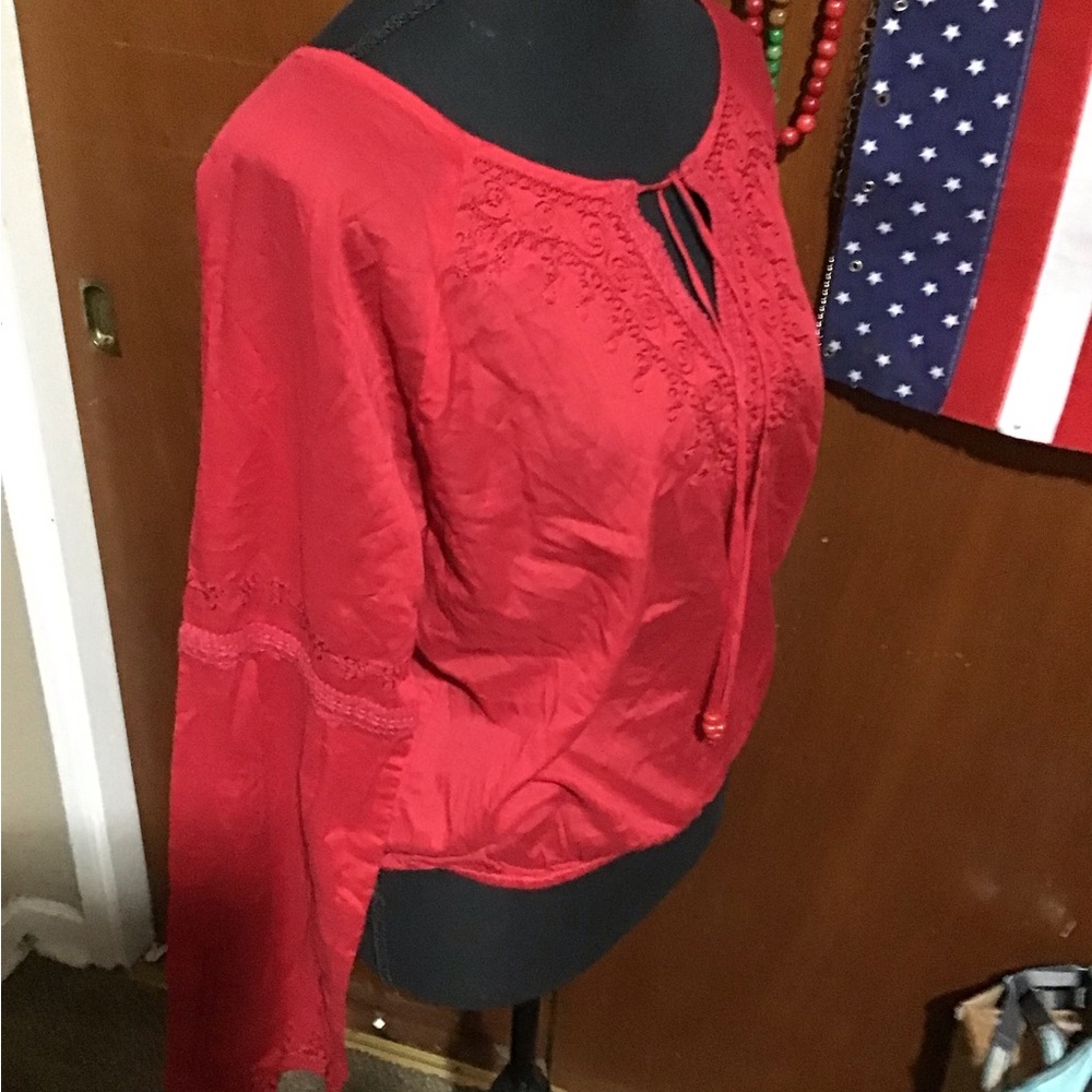 Red lace front open blouse.